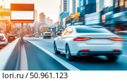 Fast-Paced Urban Transportation: White Sedan in Motion on a City Street with Billboard and Building Backdrop. Стоковое AI-изображение, AI-художник Данила Большаков / Фотобанк Лори
