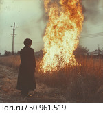Atmospheric retro photography of a man in a long coat standing in front of a tall column of flame in a dry field. A huge fire engulfs the grass, rising up against a gloomy sky and power lines. The scene is filled with tension, drama and symbolism - fire as purification, destruction or inner transformation. The image evokes strong emotions and can be used in themes of existential visualization, loneliness, memories or conceptual art. Стоковое AI-изображение, AI-художник Анна Кривицкая / Фотобанк Лори