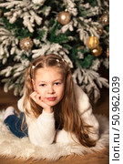 Dreaming of Christmas Morning in Front of the Decorated Christmas Tree. Стоковое фото, фотограф Aleksandr Golubev / Фотобанк Лори