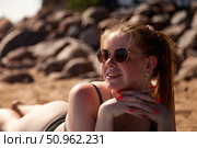 Enjoying Summer Sun on the Rocks in Maui at a Relaxing Beach. Стоковое фото, фотограф Aleksandr Golubev / Фотобанк Лори