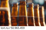 Refreshing Amber Bottles with Condensation, an Inviting Close-up for Beverage Advertising or Party Promotion. Стоковое AI-изображение, AI-художник Данила Большаков / Фотобанк Лори