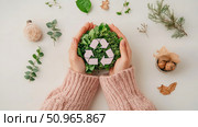 Hands cradling vibrant green leaves with a recycle emblem, symbolizing environmental care and earth preservation for eco-conscious living. Стоковое AI-изображение, AI-художник Данила Большаков / Фотобанк Лори