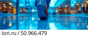 A stylish brown shoe with a blue sole steps on a glossy blue floor in a contemporary building, symbolizing forward momentum and the urban commute. Design for presentation, banner, digital art. Стоковое AI-изображение, AI-художник Данила Большаков / Фотобанк Лори