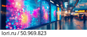 Vibrant Digital Billboards Displaying Abstract Data Visualization and Luminous Art in a Modern, Blurry Urban Concourse. Стоковое AI-изображение, AI-художник Данила Большаков / Фотобанк Лори