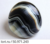 Black And White Agate Cabochon, Smooth, Polished, Close Up. Generative AI. Стоковое AI-изображение, AI-художник Roman Zavorotny / Фотобанк Лори