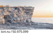Serene Coastal Cliff at Sunset: A Dramatic Seascape with Textured Stone and Calm Waters. Стоковое AI-изображение, AI-художник Данила Большаков / Фотобанк Лори