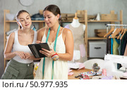 Two young female dressmakers drawing on tablet. Стоковое фото, фотограф Яков Филимонов / Фотобанк Лори