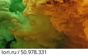 Vibrant yellow and green ink swirling in dark fluid cloud formation. Стоковое AI-видео, аниматор Владимир Федоров / Фотобанк Лори