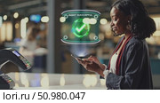 Woman using smartphone with futuristic digital payment hologram in modern urban setting. Стоковое AI-видео, аниматор Владимир Федоров / Фотобанк Лори