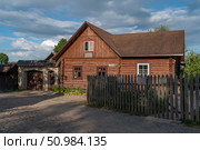 Izborsk, Pskov Region, Russia, June 9, 2024: The Blinnaya Cafe Museum in a traditional Russian wooden log house on a sunny summer day. Редакционное фото, фотограф Ula Ulachka / Фотобанк Лори