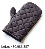 Black Quilted Oven Mitt on White Background. Generative AI. Стоковое AI-изображение, AI-художник Roman Zavorotny / Фотобанк Лори