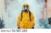 Person in full yellow protective hazmat suit and gas mask standing amidst dense smoke or fog, symbolizing environmental protection, biohazard control, or disinfection during crisis. Стоковое AI-изображение, AI-художник Данила Большаков / Фотобанк Лори