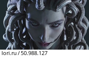 Mythical Medusa wielding penetrating stare, serpentine hair writhing, embodying legendary power and terror of ancient Greek monster narrative. Стоковое AI-видео, аниматор Данил Руденко / Фотобанк Лори