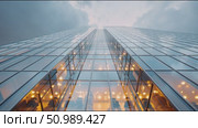 View of a modern skyscraper reflecting the sky and city lights in an urban setting. Стоковое AI-видео, аниматор Сергей Толмачёв / Фотобанк Лори