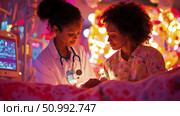 Compassionate Doctor Comforting Patient in Illuminated Hospital Room. Стоковое AI-изображение, AI-художник Данила Большаков / Фотобанк Лори