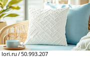 Cream and Blue Pillows on Rattan Sofa: Cozy Home Decor Scene. Стоковое AI-изображение, AI-художник Данила Большаков / Фотобанк Лори