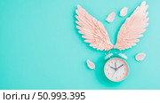 Pastel Pink Wings and Teal Alarm Clock on Aqua Background: A Serene Timepiece Composition. Стоковое AI-изображение, AI-художник Данила Большаков / Фотобанк Лори