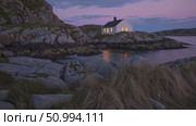 Luminous white lighthouse perched on rocky Norwegian islet, radiating tranquil beauty during soft twilight over coastal seascape. Стоковое AI-видео, аниматор Данил Руденко / Фотобанк Лори