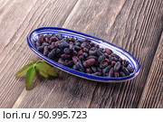 Sweet juicy ripe honeysuckle berries. Стоковое фото, фотограф Андрей Старостин / Фотобанк Лори