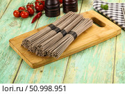 Raw dry bukwheat soba noodles. Стоковое фото, фотограф Андрей Старостин / Фотобанк Лори