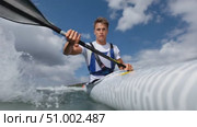 Athletic kayaker paddling energetically through ocean waves. Стоковое AI-видео, аниматор Юрий Поздников / Фотобанк Лори