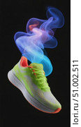 Running shoes with colorful smoke trails on black background. Стоковое AI-видео, аниматор Юрий Поздников / Фотобанк Лори