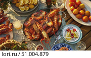 Gather around for a delightful gathering featuring fresh seafood, colorful citrus, and drinks, perfect for a sunny coastal afternoon. Стоковое AI-видео, аниматор Данила Большаков / Фотобанк Лори