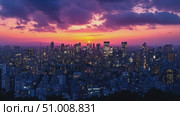 A breathtaking sunset casts a warm glow over a lively city, highlighting skyscrapers against a colorful sky during the evening hours. Стоковое AI-видео, аниматор Данила Большаков / Фотобанк Лори