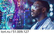 A scientist analyzes an advanced holographic brain model in a modern research lab, showcasing groundbreaking technology in neuroscience. Стоковое AI-видео, аниматор Данила Большаков / Фотобанк Лори