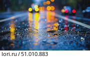 A serene urban street glistens with rainwater, reflecting colorful lights, as evening descends and cars pass by in tranquil beauty. Стоковое AI-видео, аниматор Данила Большаков / Фотобанк Лори