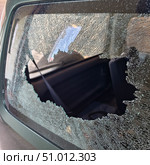 Thief broken car window. Criminal incident and vandalism on the city streets. Стоковое фото, фотограф Сергей Пристяжнюк (Serg Zastavkin) / Фотобанк Лори