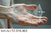 A hand displays cutting-edge digital designs, blending innovation, technology, artistic creativity, and engineering. Стоковое AI-видео, аниматор Данила Большаков / Фотобанк Лори