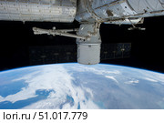 SpaceX Dragon during its docking with the International Space Station. Стоковое фото, фотограф Stocktrek Images, Inc. / ТАСС / Фотобанк Лори