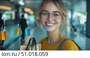 A cheerful young woman stands in an airport terminal, holding shopping bags with a big smile, radiating joy and excitement for her travels. Стоковое AI-видео, аниматор Данила Большаков / Фотобанк Лори