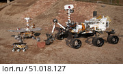 Three generations of Mars rovers. Стоковое фото, фотограф Stocktrek Images, Inc. / ТАСС / Фотобанк Лори