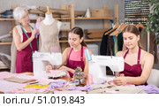 Woman and girl tailors sewing, senior female designer work with mannequin. Стоковое фото, фотограф Яков Филимонов / Фотобанк Лори