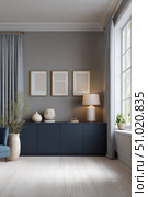 Modern living room interior with elegant decor, navy sideboard, ceramic vases, soft lighting, and framed minimalist art, styled with natural textures and daylight from large window. Стоковое AI-изображение, AI-художник Катерина Бондарец / Фотобанк Лори