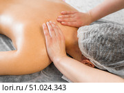 Top view close up of masseuse hands massing female neck skillfully. Spa, health and relaxation concept. Стоковое фото, фотограф Владислав Тригуб / Фотобанк Лори