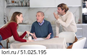 Couple discussing inheritance with older man. Стоковое видео, видеограф Яков Филимонов / Фотобанк Лори