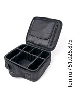 Large open empty black cosmetic suitcase with many compartments on white background. Стоковое фото, фотограф Катерина Белякина / Фотобанк Лори