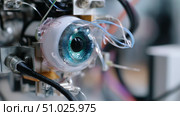 Innovative robotic eye technology showcases intricate design and advanced engineering in a laboratory setting. Стоковое AI-изображение, AI-художник Сергей Толмачёв / Фотобанк Лори