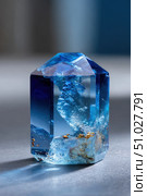 Large blue crystal with gold inclusions casting shadow. Стоковое AI-изображение, AI-художник Юрий Поздников / Фотобанк Лори