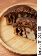 Decadent chocolate dessert served on a wooden plate with a vibrant texture and richness. Стоковое фото, фотограф Сергей Толмачёв / Фотобанк Лори