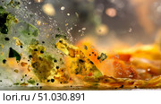 Close-up of moldy food waste breaking down, science concept. Expired Organic bio waste. Biodegradable waste decomposing, a mix of fruits and vegetables beginning the decomposition process. Mix Vegetables and fruits in a huge container. Стоковое AI-изображение, AI-художник ALLA YURTAYEVA / Фотобанк Лори