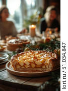 Delicious Dessert With Pie and Refreshments on Wooden Table During a Casual Gathering. Стоковое AI-изображение, AI-художник Юлия Гапеенко / Фотобанк Лори
