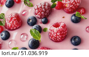 Colorful raspberries and blueberries create a delightful splash in a creamy dessert mix, bringing freshness and flavor to the kitchen. Стоковое AI-видео, аниматор Данила Большаков / Фотобанк Лори