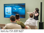 Speaker presenting ideas to group during a professional workshop session. Стоковое фото, фотограф Антон Гвоздиков / Фотобанк Лори