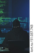 A Mysterious Figure in a Dark Environment Focused on a Laptop Surrounded by Digital Code, Representing Themes of Cybersecurity and Hacking Activities. Стоковое AI-видео, аниматор Владимир Федоров / Фотобанк Лори
