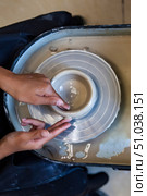 Shaping Clay on Potter's Wheel at Her Pottery Workshop During the Day. Стоковое фото, фотограф Aleksandr Golubev / Фотобанк Лори
