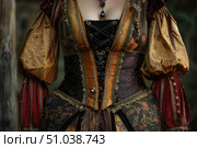 Woman wearing renaissance dress with criss cross bodice and puffy sleeves. Стоковое AI-изображение, AI-художник Иван Рябоконь / Фотобанк Лори